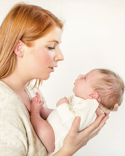 mum and newborn baby in merino layette