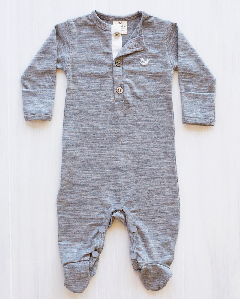 baby wearing north sea blue strip merino jumpsuit