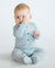 baby wearing north sea blue strip merino jumpsuit