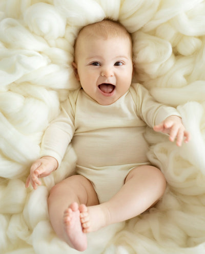 smiling baby cream merino bodysuits