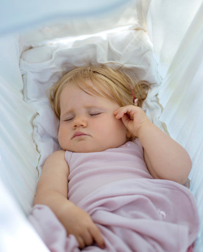 sleeping baby in merino singlet bodysuit