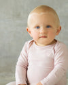 pink baby merino bodysuit