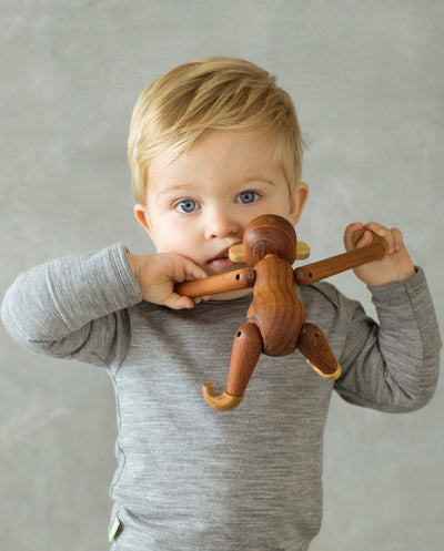 boy wearing grey organic merino bodysuit